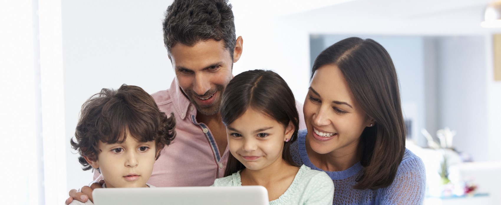 Happy parents with children looking at their study results