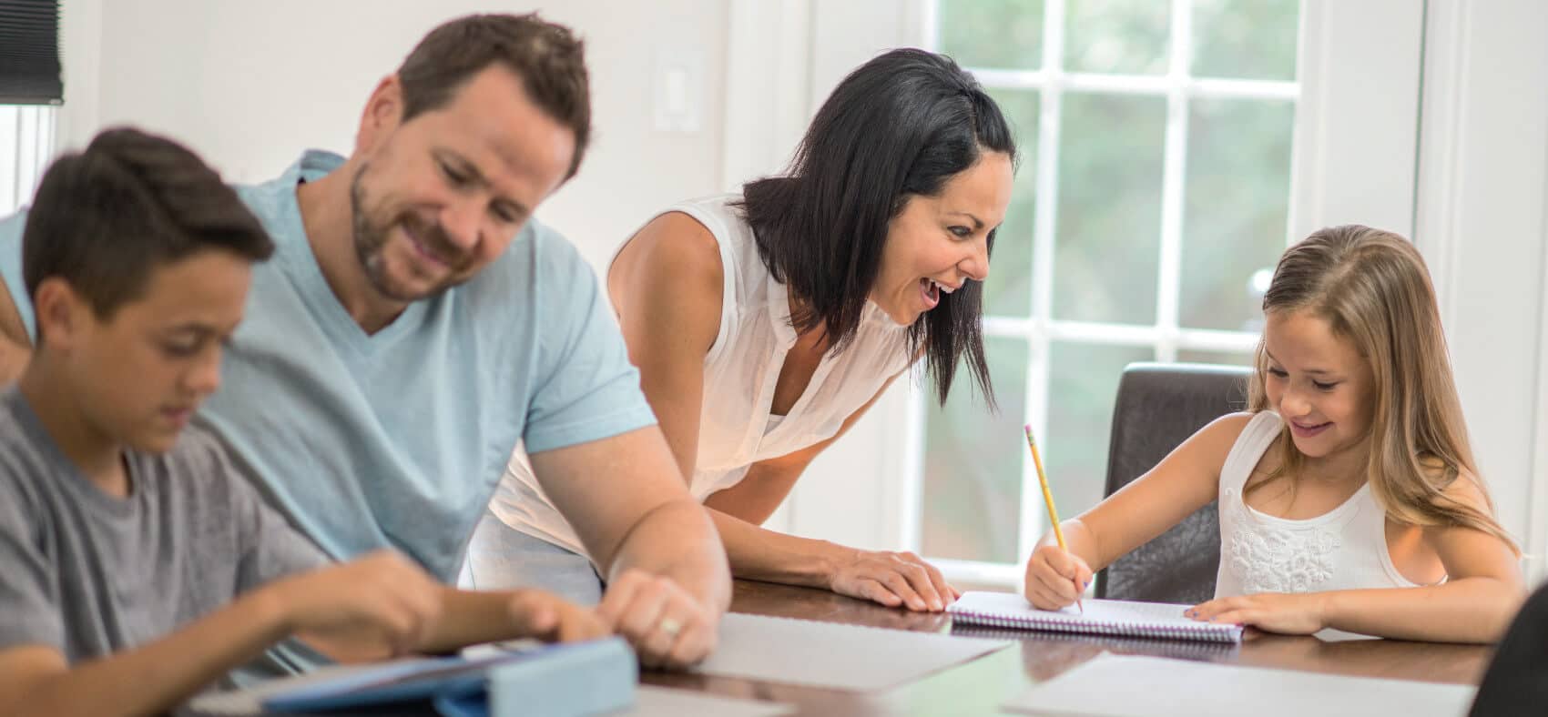 Happy parents studying with their children