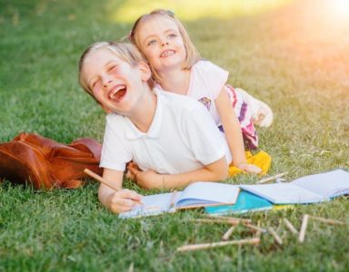 Two children learning outside