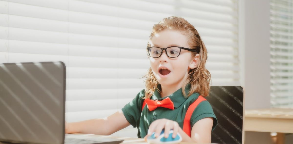 Child studying laptop to build healthy learning habits