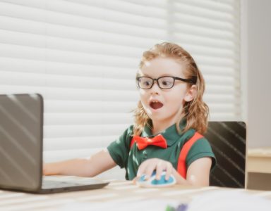 Child studying laptop to build healthy learning habits